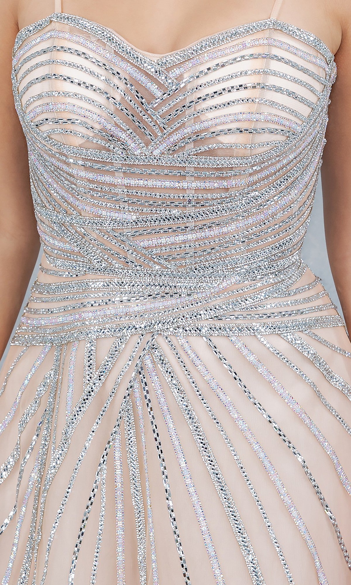 Close-up of the Cinderella Couture 8569J Long Prom Dress, featuring a sleeveless nude design with silver sequin patterns, crystal beaded embellishments, and a fitted bodice.